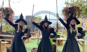 Three women dressed as witches and wizards on Newcastle’s Quayside